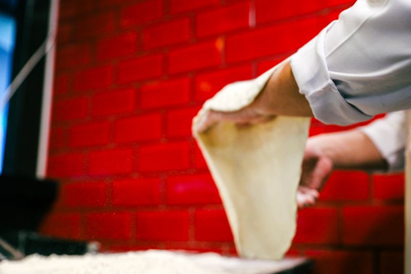 giordanos pizza restaurant kitchen team preparing deep dish pizza